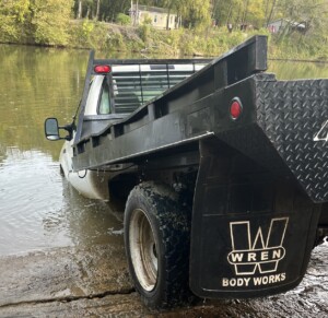 Monroe County truck in river